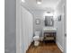 Bathroom with classic fixtures, wood flooring, and shower with curtain at 1535 Caraleigh Mills Ct # 105, Raleigh, NC 27603