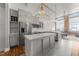 Spacious kitchen with white countertops, stainless steel appliances, with gray cabinets in a loft style at 1535 Caraleigh Mills Ct # 105, Raleigh, NC 27603