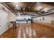 Kitchenette area featuring white cabinets, stainless steel appliances, and an open floor plan at 1535 Caraleigh Mills Ct # 105, Raleigh, NC 27603
