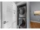 Convenient laundry closet with stacked washer and dryer units for efficient space utilization at 1535 Caraleigh Mills Ct # 105, Raleigh, NC 27603