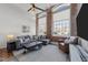 Cozy living room featuring exposed brick, large windows, and a comfortable sectional sofa at 1535 Caraleigh Mills Ct # 105, Raleigh, NC 27603