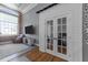 Living room area with exposed brick walls, hardwood floors, and a cozy seating arrangement at 1535 Caraleigh Mills Ct # 105, Raleigh, NC 27603