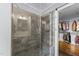 Beautiful shower with tile surround and bench, and open access to walk-in closet at 1535 Caraleigh Mills Ct # 105, Raleigh, NC 27603