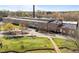 Aerial view of a multi-story brick building and a walking bridge at 1535 Caraleigh Mills Ct # 105, Raleigh, NC 27603