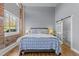 Bedroom with an ensuite bathroom, sliding door and hardwood floors at 1535 Caraleigh Mills Ct # 105, Raleigh, NC 27603