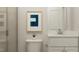 Modern bathroom featuring a glass door shower and a clean white vanity at 1573 Goldfinch Perch Ln, Knightdale, NC 27545
