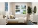 Cozy bedroom with a bed, side tables, and a window at 1573 Goldfinch Perch Ln, Knightdale, NC 27545