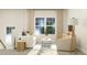 Bright living room with white couch, area rug, and modern decor at 1573 Goldfinch Perch Ln, Knightdale, NC 27545