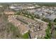 An aerial view captures a dense residential area with well-manicured landscapes and a central roundabout at 162 Arabella Ct, Cary, NC 27518