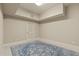 Finished basement with blue rug, a louvered door to storage, and neutral paint at 162 Arabella Ct, Cary, NC 27518