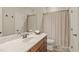 Bathroom features a vanity with marble countertop and neutral shower curtain at 162 Arabella Ct, Cary, NC 27518