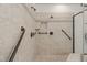 Luxurious bathroom featuring walk-in shower with grab bars and elegant tile work at 162 Arabella Ct, Cary, NC 27518
