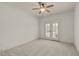 Inviting bedroom with balcony access, ceiling fan and neutral color palette, perfect for relaxation at 162 Arabella Ct, Cary, NC 27518
