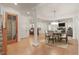 Elegant dining room featuring hardwood floors, classic columns, and a stylish chandelier over the dining table at 162 Arabella Ct, Cary, NC 27518
