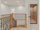 Hallway features an elevator and stairwell with carpet and natural wood at 162 Arabella Ct, Cary, NC 27518
