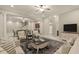 Inviting living room featuring seating, stylish rug and open floorplan, great for entertaining at 162 Arabella Ct, Cary, NC 27518