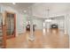 Spacious living room with beautiful hardwood floors, white pillars, and a stone fireplace at 162 Arabella Ct, Cary, NC 27518
