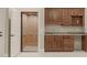 Additional Living space with elevator, granite countertops and brown cabinetry at 162 Arabella Ct, Cary, NC 27518