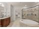 Luxurious bathroom features a soaking tub, tile floors and a glass enclosed shower at 162 Arabella Ct, Cary, NC 27518