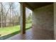 Covered patio featuring brick columns and a stamped concrete floor at 162 Arabella Ct, Cary, NC 27518