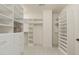 Well-organized walk-in closet offering generous storage space and customizable shelving at 162 Arabella Ct, Cary, NC 27518