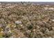 Aerial view of neighborhood with mature trees and city skyline in the background at 1628 Park Dr, Raleigh, NC 27605