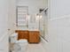 Bathroom featuring a vanity, sink, mirror, toilet, and shower, all with white tile at 1628 Park Dr, Raleigh, NC 27605