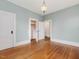 Bedroom showcasing hardwood floors, two closets, and a light-blue painted wall at 1628 Park Dr, Raleigh, NC 27605