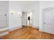 Bedroom with pristine white walls, hardwood floors, two closets, and access to other rooms at 1628 Park Dr, Raleigh, NC 27605