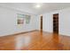 Bedroom features pristine white walls, hardwood floors, and a closet at 1628 Park Dr, Raleigh, NC 27605