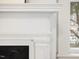 Close-up on an elegant fireplace with detailed molding at 1628 Park Dr, Raleigh, NC 27605