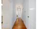 Long hallway showcasing hardwood floors and multiple doors, leading to other rooms at 1628 Park Dr, Raleigh, NC 27605