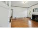 Bright living room with hardwood floors, fireplace, and freshly painted walls at 1628 Park Dr, Raleigh, NC 27605