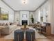 Inviting living room features a fireplace, plush seating, and hardwood floors at 1628 Park Dr, Raleigh, NC 27605