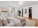Bedroom featuring pristine white walls, hardwood floors, and a walk-in closet at 1628 Park Dr, Raleigh, NC 27605