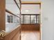 Bright sunroom with wood flooring and large windows at 1628 Park Dr, Raleigh, NC 27605