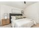 Bedroom offers a tufted headboard, white bedding, and views of the surrounding nature at 168 Daphine Dr, Hillsborough, NC 27278
