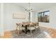 Formal dining room with modern chandelier, seating for six, and scenic views at 168 Daphine Dr, Hillsborough, NC 27278