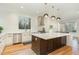 Modern kitchen with white cabinets, stainless steel appliances, and a large center island at 168 Daphine Dr, Hillsborough, NC 27278