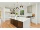 Contemporary kitchen featuring a large center island, stainless steel appliances, and modern lighting at 168 Daphine Dr, Hillsborough, NC 27278