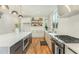 Bright, modern kitchen with stainless steel appliances, expansive counter space, and sleek cabinetry at 168 Daphine Dr, Hillsborough, NC 27278
