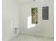 The laundry room features a sleek marble floor, window with treeline views, and modern fixtures at 168 Daphine Dr, Hillsborough, NC 27278