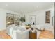 Bright living room with large sliding doors, modern furniture, and light hardwood floors at 168 Daphine Dr, Hillsborough, NC 27278