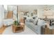 Open-concept living space with modern decor, hardwood floors, and adjoining kitchen and dining area at 168 Daphine Dr, Hillsborough, NC 27278
