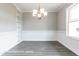 Bright dining room features a chandelier, wainscoting, and built-in shelving at 169 Tigris Ct, Zebulon, NC 27597