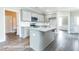 Modern kitchen with granite countertops, stainless steel appliances, and large center island at 169 Tigris Ct, Zebulon, NC 27597