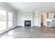 Spacious living room features a fireplace, built-in shelving, and access to the outside at 169 Tigris Ct, Zebulon, NC 27597