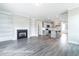 Open living space with a fireplace, built-ins, and a modern kitchen at 169 Tigris Ct, Zebulon, NC 27597