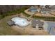 Aerial view displaying the community pool and clubhouse amidst a residential area at 1715 Capstone Dr, Durham, NC 27713