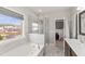Elegant bathroom with a soaking tub, a glass-enclosed shower, and modern fixtures at 1715 Capstone Dr, Durham, NC 27713